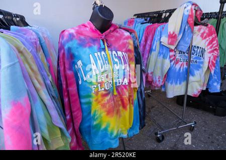 St. Augustine, Florida - December 28, 2022: Colorful rainbow colored tie-dye hoodies and sweatshirts for sale outside of a gift shop in St. Augustine' Stock Photo