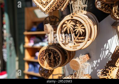 St. Augustine, Florida - December 28, 2022: Wooden laser printed ornament featuring a beach palm tree scene for sale in a St. Augustine trinket gift s Stock Photo