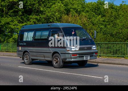 1994 90s nineties Grey Silver Toyota Hi-Ace Cruising Cabin crossing motorway bridge in Greater Manchester, UK Stock Photo