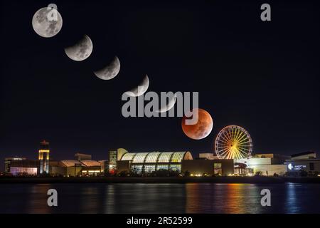 Lunar Eclipse Sequence - The progression of the Beaver full blood moon lunar eclipse.  Also seen is the illuminated Dream Wheel ferris wheel at Americ Stock Photo