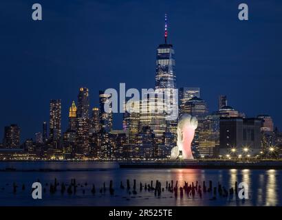 The lower Manhattan New York City skyline showcasing the World Trade Center commonly referred to as the Freedom Tower. Across from the Hudson River is Stock Photo