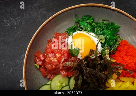 seaweed-infused pibimpap with flying fish roe, meat, fish, and nori Stock Photo