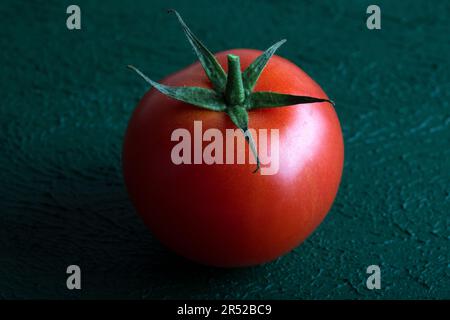 Fresh grape tomato on green background,closeup Stock Photo