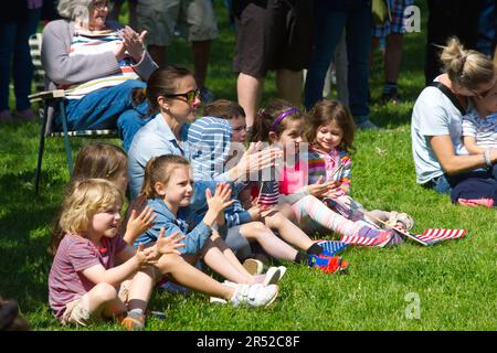 Memorial Day Event.  Dennis, Massachusetts, (Cape Cod) , USA.  Children clapping at the event Stock Photo