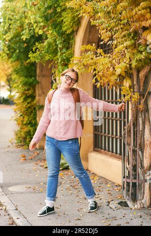 Outdoor portrait of young teenage girl with backpack, education and back to school concept Stock Photo