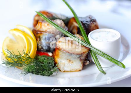 Prepared sea fish portions with greens and vegatables (closup) (selective focus) Stock Photo