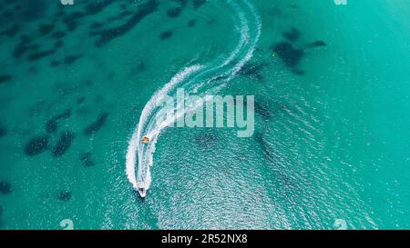 Aerial view on motorboat and jetski on the sea surface Stock Photo - Alamy