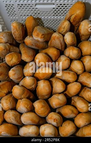 Basket full of loaves of bread inside the bakery Stock Photo