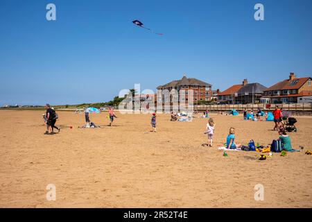 West Kirby Beach, The Wirral, Merside, UK. People enjoying the a hot day at the beach. Stock Photo