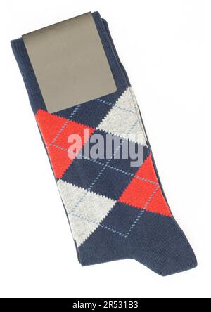 Elegant folded classic men socks with paper label isolated on white background Stock Photo
