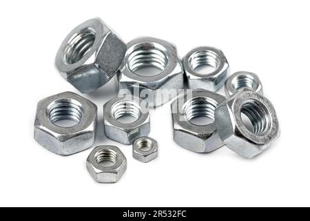 Close-up of steel screw nuts in different sizes on white background Stock Photo