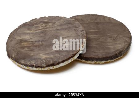 Dark chocolate covered round rice cake biscuits isolated on white background Stock Photo
