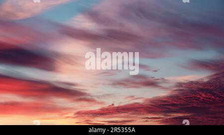 Colorful cloudy sky at sunset. Gradient color. Sky texture, abstract nature background. Stock Photo