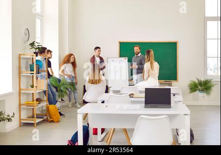 Professor giving lectures to group of university students Stock Photo