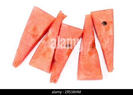 Triangle shaped watermelon slices isolated on white background. Pieces of red fruit with black seeds Stock Photo