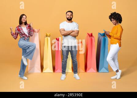 Smiling multiracial young people enjoying season sale, collage Stock Photo