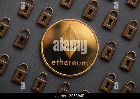 Ethereum coin with padlock on black background. Ethereum security. Digital cyber safety or security encryption, Blockchain technology to encode online Stock Photo