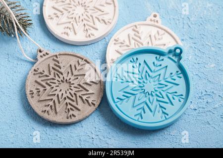Concrete Christmas Decorations. Handmade craft gypsum objects for interior decoration. Artisan, small business, diy, hobby concept. Stock Photo