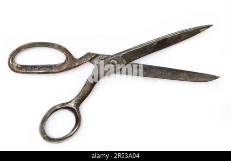 Old and rusty retro dressmaking scissors isoilated on white background. Traditional fashion equipment Stock Photo