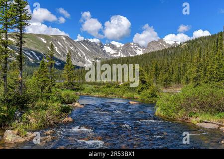 Spring Mountain Creek - South Saint Vrain Creek at Long Lake, with Indian Peaks towering in background, on a Spring morning. Indian Peaks Wilderness. Stock Photo