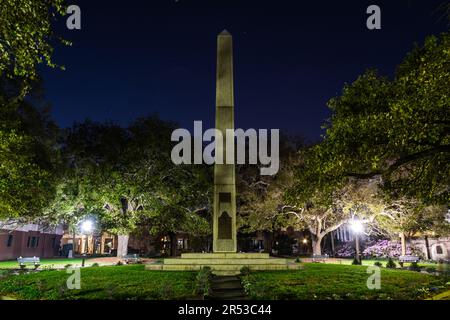 The haunted Washington Square in Charleston, South Carolina at night illuminated by the park lights. Stock Photo