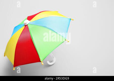 Mini colorful umbrella on white background Stock Photo