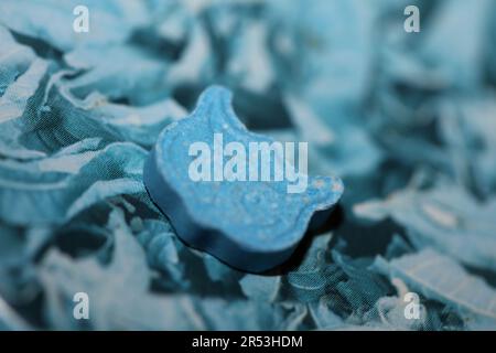 Blue ecstasy owl pill with mdma very strong dope close up background party times psychedelic season high quality big size prints Stock Photo