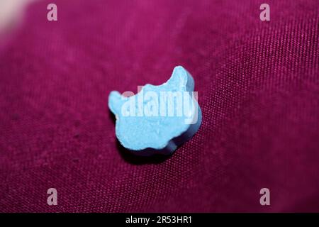 Blue ecstasy owl pill with mdma very strong dope close up background party times psychedelic season high quality big size prints Stock Photo