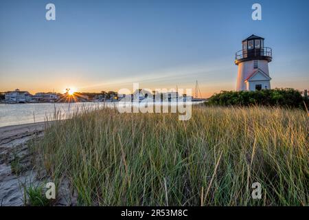 Sunrise at Cape Cod's Hyannis Harbor Lighthouse near Martha's Vineyard, New England USA. Stock Photo