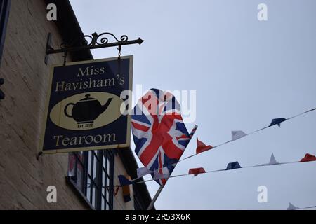 Sign for Miss Havisham's Tea Room in Stony Stratford, with Union Jack and bunting. Stock Photo