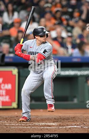 Minnesota Twins catcher Christian Vazquez (8) batting in the top of the fifth inning during the MLB game between the Minnesota Twins and the Houston A Stock Photo