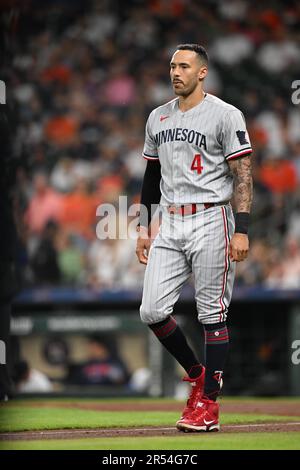 FILE - Minnesota Twins' Carlos Correa walks off the field with his 2021  Golden Glove and Platinum Glove awards presented to him prior to a baseball  game with the Seattle Mariners, Monday