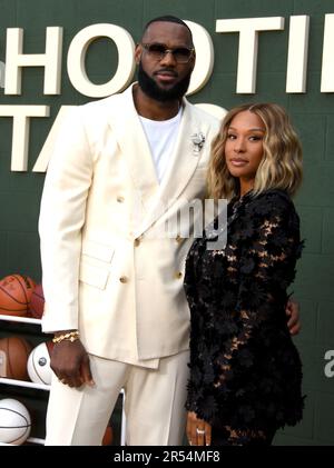 Basketball player LeBron James (R) and Savannah Brinson attend the 2013 ...