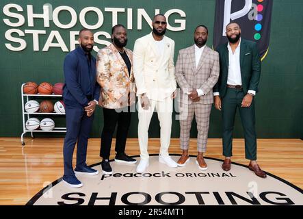 NBA basketball player LeBron James, third from right, poses with his high  school basketball coach and teammates, from left, Dru Joyce II, Lil' Dru  Joyce III, Sian Cotton, Willie McGee and Romeo Travis at the premiere of  the Peacock film Shooting Stars