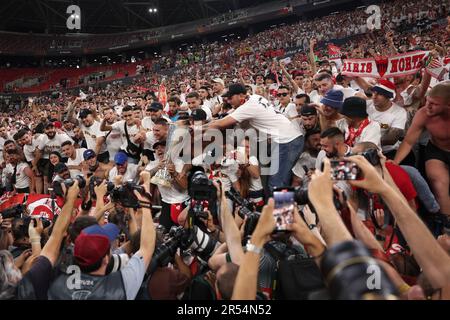 Budapest, Hungary. 31st May, 2023. Sevilla FC fans celebrate with the trophy following the penalty shoot out victory in the UEFA Europa League match at Puskas Arena, Budapest. Picture credit should read: Jonathan Moscrop/Sportimage Credit: Sportimage Ltd/Alamy Live News Stock Photo