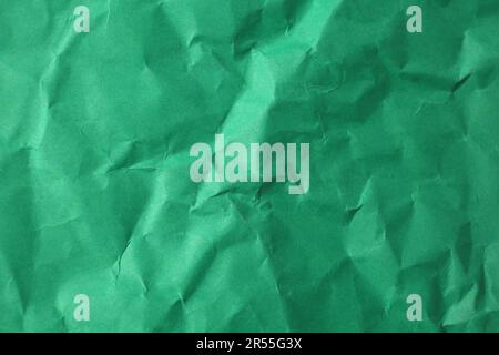 Sheet of crumpled green paper as background, top view Stock Photo