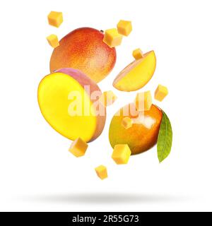 Delicious mango fruits and leaf falling on white background Stock Photo