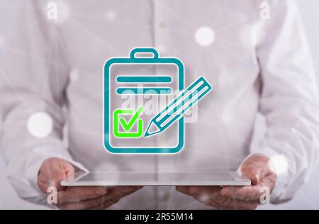 Document validation concept above a tablet held by a man in background Stock Photo