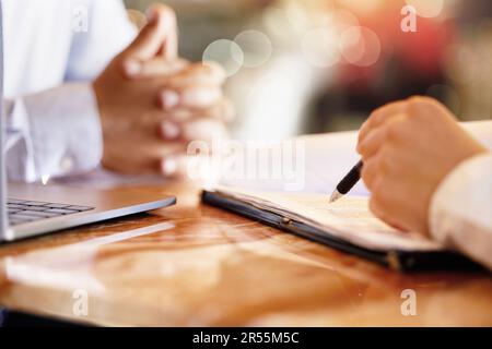 Hands, notebook and writing with a human resources interview for a job opportunity or vacancy. Flare, hiring and recruitment with an hr manager Stock Photo