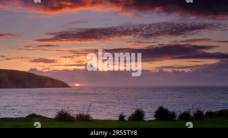 Cardigan, UK - September 22, 2022:  Storm clouds and sunset over Cardigan Bay, Wales Stock Photo