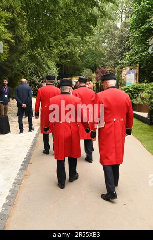 London, UK, 22nd May 2023.  Group of Chelsea Pensioners walking away at RHS Chelsea Flower Show. Stock Photo