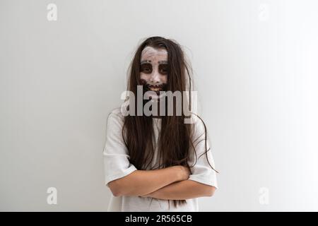 scary girl in white dress from horror film in room Stock Photo - Alamy