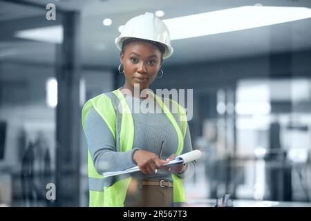 Architect, portrait and checklist for construction or building inspection, survey and checking logistics on project. Black woman, working on clipboard Stock Photo