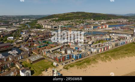 Editorial Swansea, UK - May 21, 2023: Drone view of Swansea Bay, Marina, docks, River Tawe and the East Side under Kilvey Hill. Stock Photo