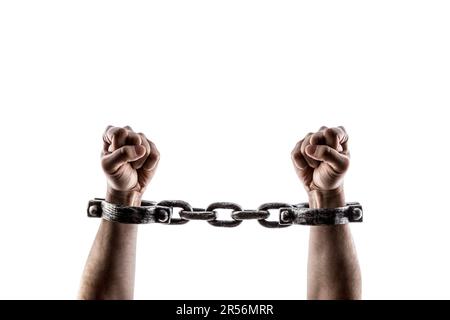 Shackled hands isolated on white background with clipping path Stock Photo