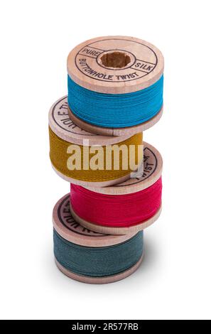 Sewing Bobbins Pile Cut Out on White. Stock Photo