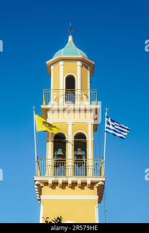 Orthodox church of Saint Spiridon bell tower with Greek & Byzantine flags waving in Argostolion Town on the Ionian Island of Cephalonia Greece. Stock Photo