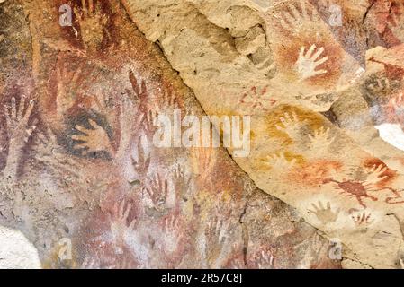 Prehistoric art - handprints in Cueva de las Manos cave and complex of rock art sites in Santa Cruz province, Argentina Stock Photo