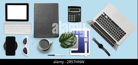 Big collage of modern devices with office stationery and cup of coffee on light blue background Stock Photo