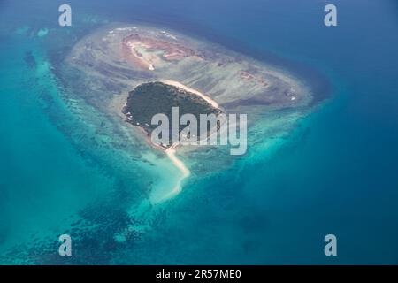 Tropical paradise beautiful island viewed from above, aerial view on crystal clear turquoise blue and green waters, Stock Photo